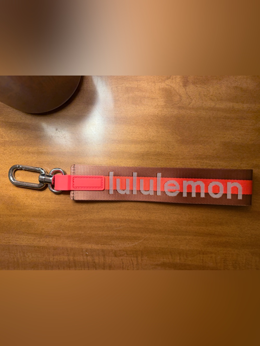 lululemon Logo Key Fob Strap in Brown & Neon Coral